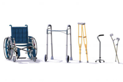 A collection of mobility aids including a wheelchair, walker, crutches, quad cane, and forearm crutches